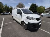 a white van that is parked in a parking lot