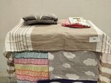 an image of a bed made out of old clothes