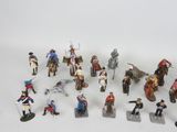 a lot of figurines that are sitting on a table