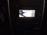 a picture of a car dashboard with a picture of a bird on the screen