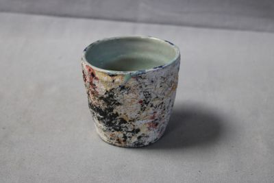 a small cup that is sitting on a table