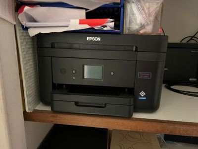 a printer that is sitting on top of a desk