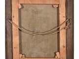 an old picture frame with rope hanging on a wall