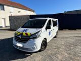 a white van parked in front of a house with a blue sky in the background