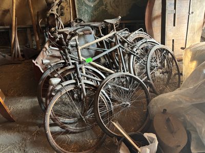 many bicycles that are parked in a garage