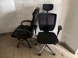 a black office chair and a black office chair next to each other