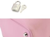 the pink purse has a lock on it and a key in it