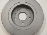 an image of a close up of a brake disc on a white surface
