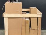 a stack of boxes and cans of soda on a pallet