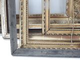 a large mirror that has a lot of gold in it