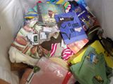 a white bag full of clothing and other items in it