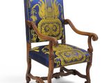 a blue and yellow chair with a gold and blue pattern