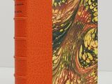 an orange book with a picture of a bird on it