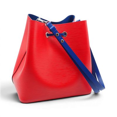 a red and blue handbag with a blue strap on a white background