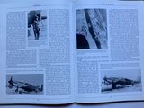 an open book with a picture of a plane on it