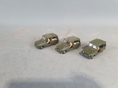 three toy cars that are sitting on a table