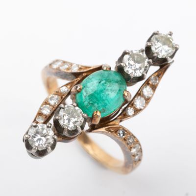 an image of an emerald and diamond ring on a white background