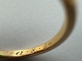a close up of a ring with a diamond in it
