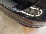 a close up of a car ' s rear bumper