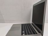 a laptop computer sitting on a table with a white background