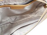the inside of a white purse with a gold zipper