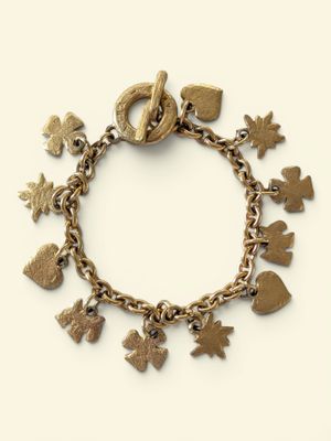 a close up of a bracelet with charms on a white background