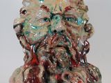 a ceramic sculpture of a man with a beard