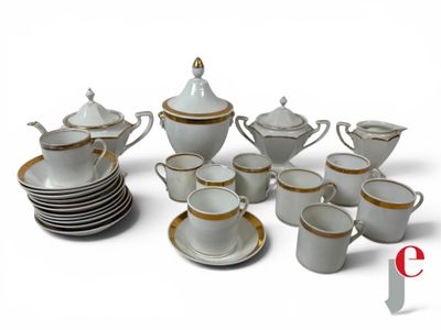 a white and gold tea set with cups and saucers