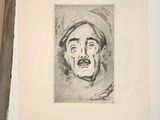 a drawing of a man ' s face on a piece of paper