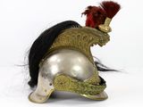 helmet of a roman soldier with a red mohawk on a white background