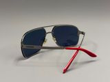 silver and red sunglasses on a white surface with a white background