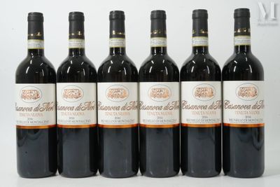 six bottles of wine are lined up in a row on a white surface