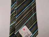 a tie with a tag on it on a table