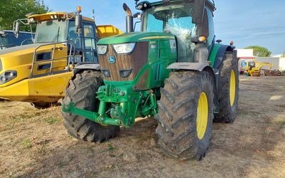 a tractor that is parked in the dirt