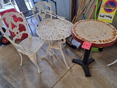 several chairs and a table in a room with a lot of furniture