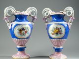 pair of blue and white vases with floral designs on them