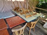 a table and chairs on the deck of a tent