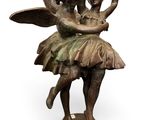 bronze statue of a fairy and a ballerina on a pedestal