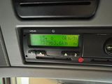 a radio in the dash of a car with a green screen