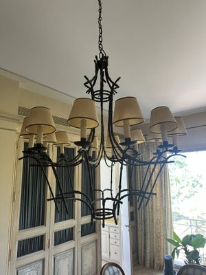 a chandelier that is hanging from the ceiling in a dining room