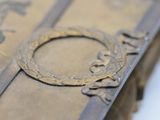 a close up of a book with a ring on top of it