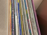 a lot of cds in a box on the table