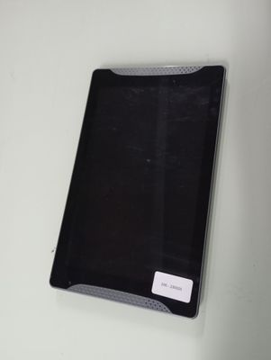 a black tablet computer sitting on top of a white table
