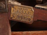 a close up of an old sewing machine with a label on it