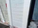 an image of a refrigerator that has been wrapped in plastic
