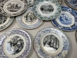 a lot of plates that are on the table