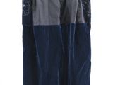 blue and black skirt with buttons on a hanger on a white background