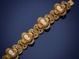 a gold bracelet with cameo cameos and filigrees