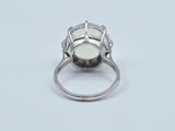 a close up of a ring with a stone in it
