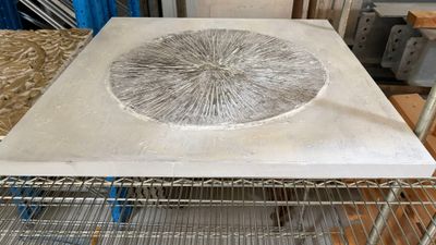 a picture of a table made out of concrete and wire